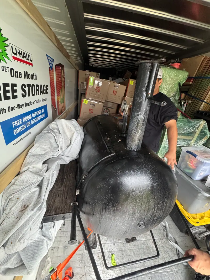 Steel offset smoker staged for heavy item removal in Burnet County